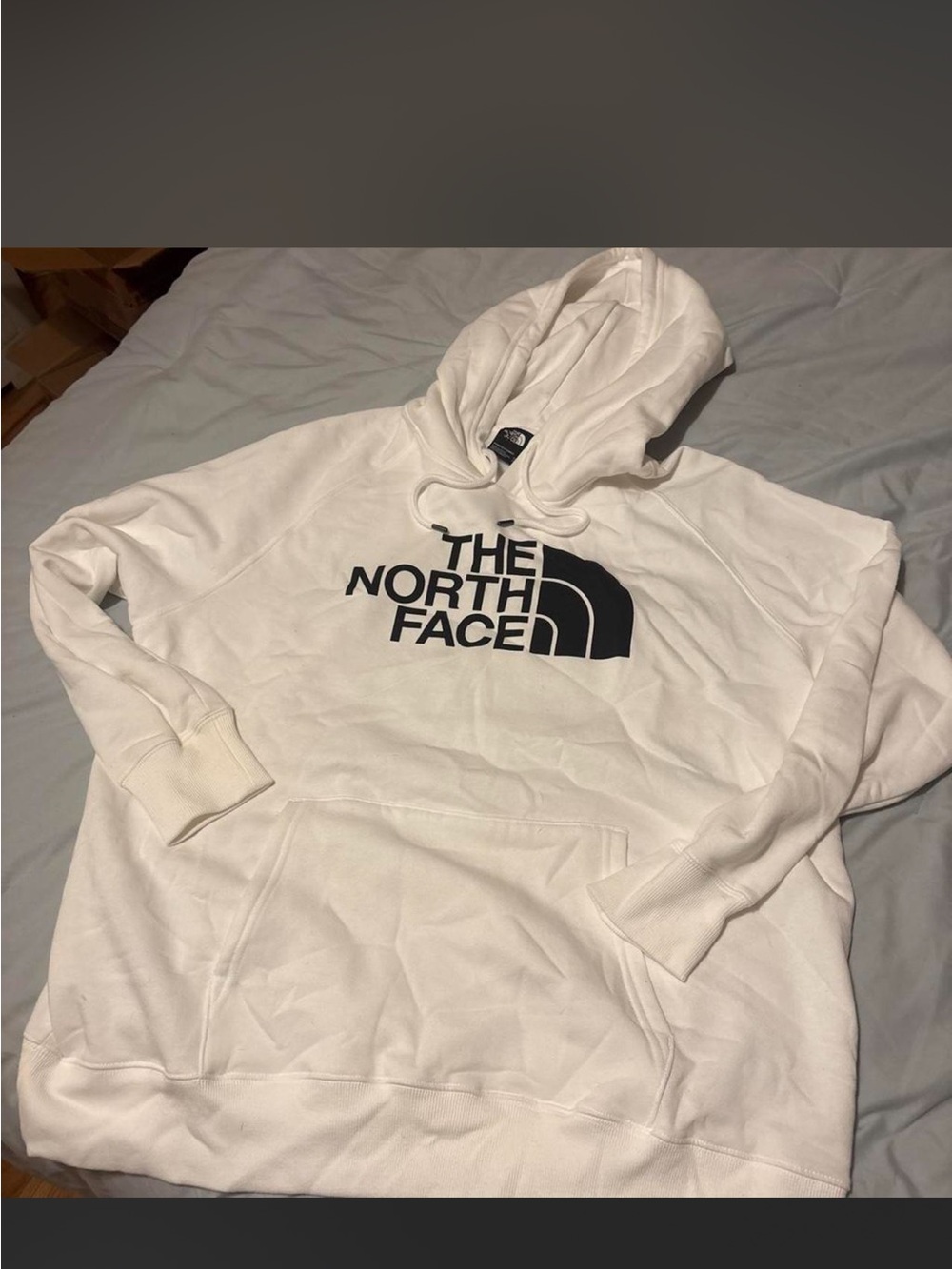 The North Face women’s White Hoodie with Black Logo